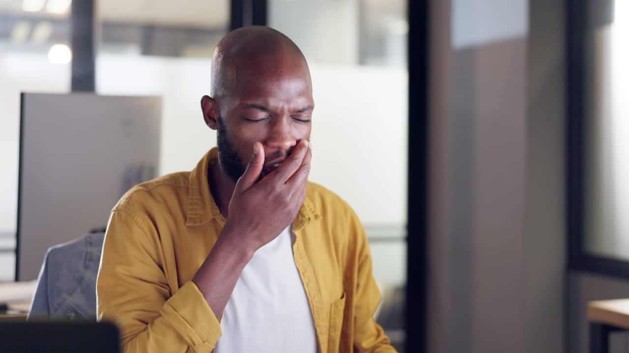 Burnout, tired or black man yawn in office