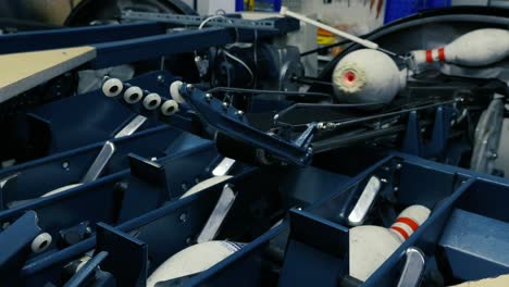 bowling pins resetting in an automatic pinsetter machine for a bowling alley