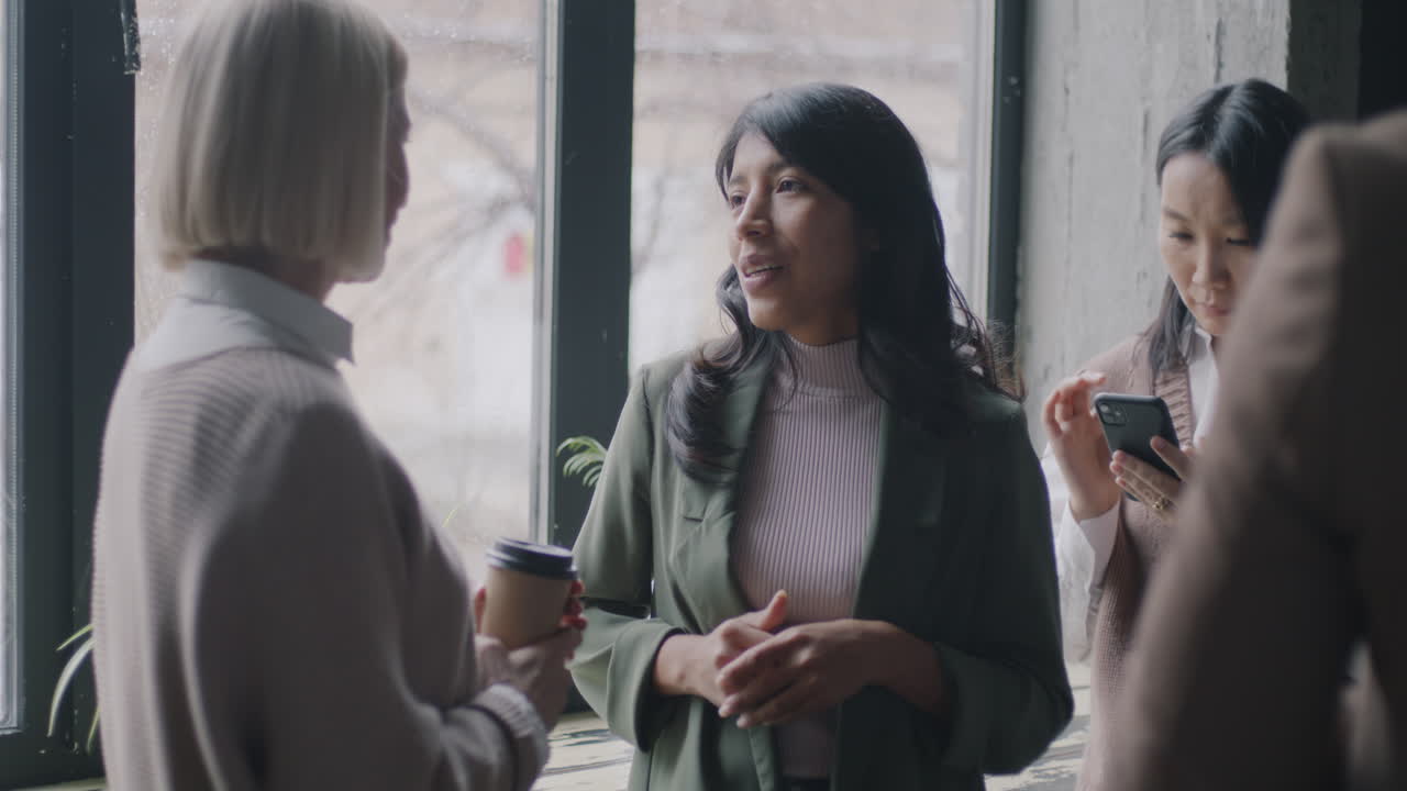 Women in Conversation at a Cafe Window