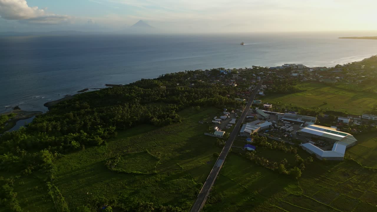 Coastal View Of Warehouses And Housing Complex Near Timbaan, San Andres, Catanduanes, Philippines. Aerial Drone Shot