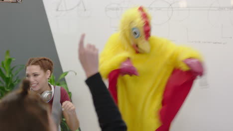 dancing-chicken-happy-business-students-enjoying-funny-dance-party-in-boardroom-meeting-celebrating-successful-victory-crazy-rooster-high-five-colleagues-in-excited-office-presentation