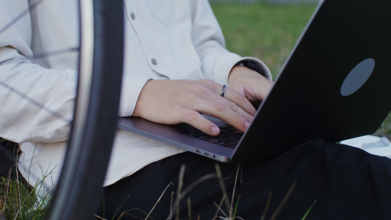Person working on laptop outdoors