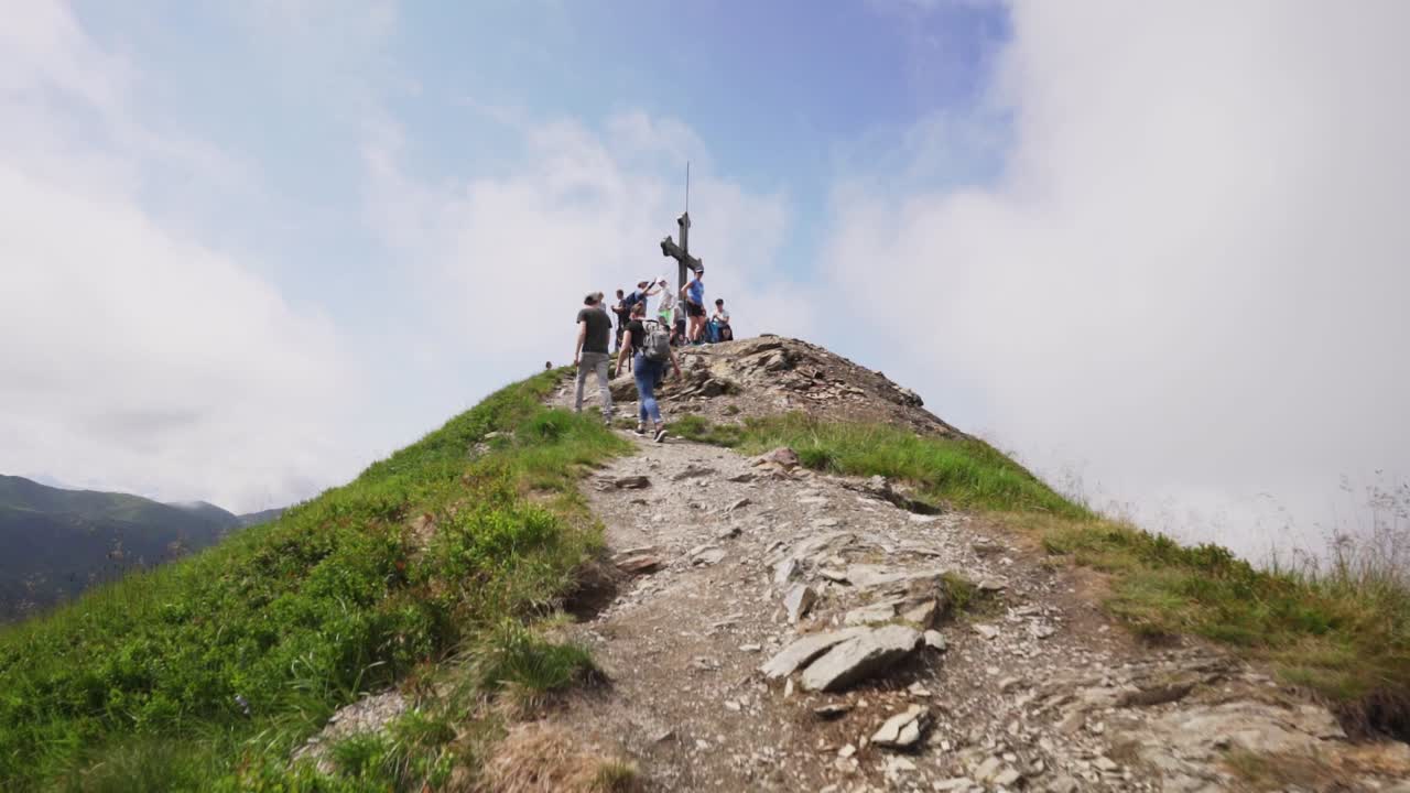 POV Hiking shot, showing off the hikers reaching the peak of the mountain.