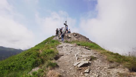 pov hiking shot, showing off the hikers reaching the peak of the mountain.