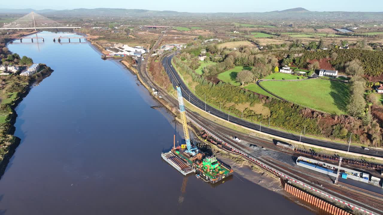 Birds Eye view of their transport systems for Waterford City,River Suir, railway, and road system early morning