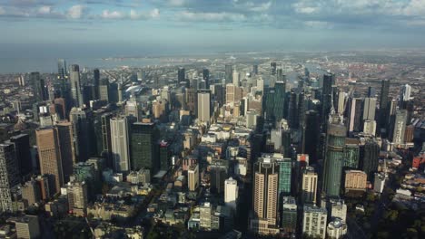 drone ascent high over melbourne city at sunrise