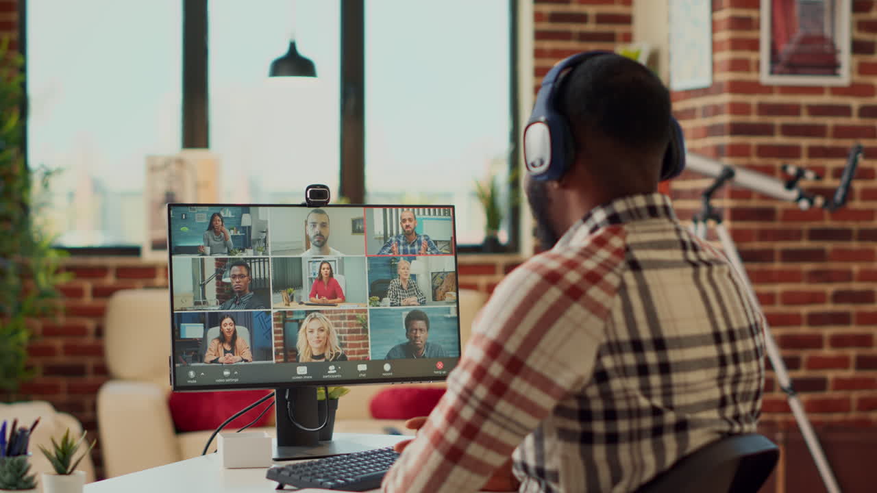 Businessman attending online corporate meeting on computer
