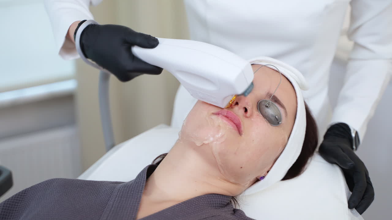 Woman receiving a facial treatment