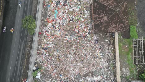 aerial overhead shot over a landfill in bali, indonesia