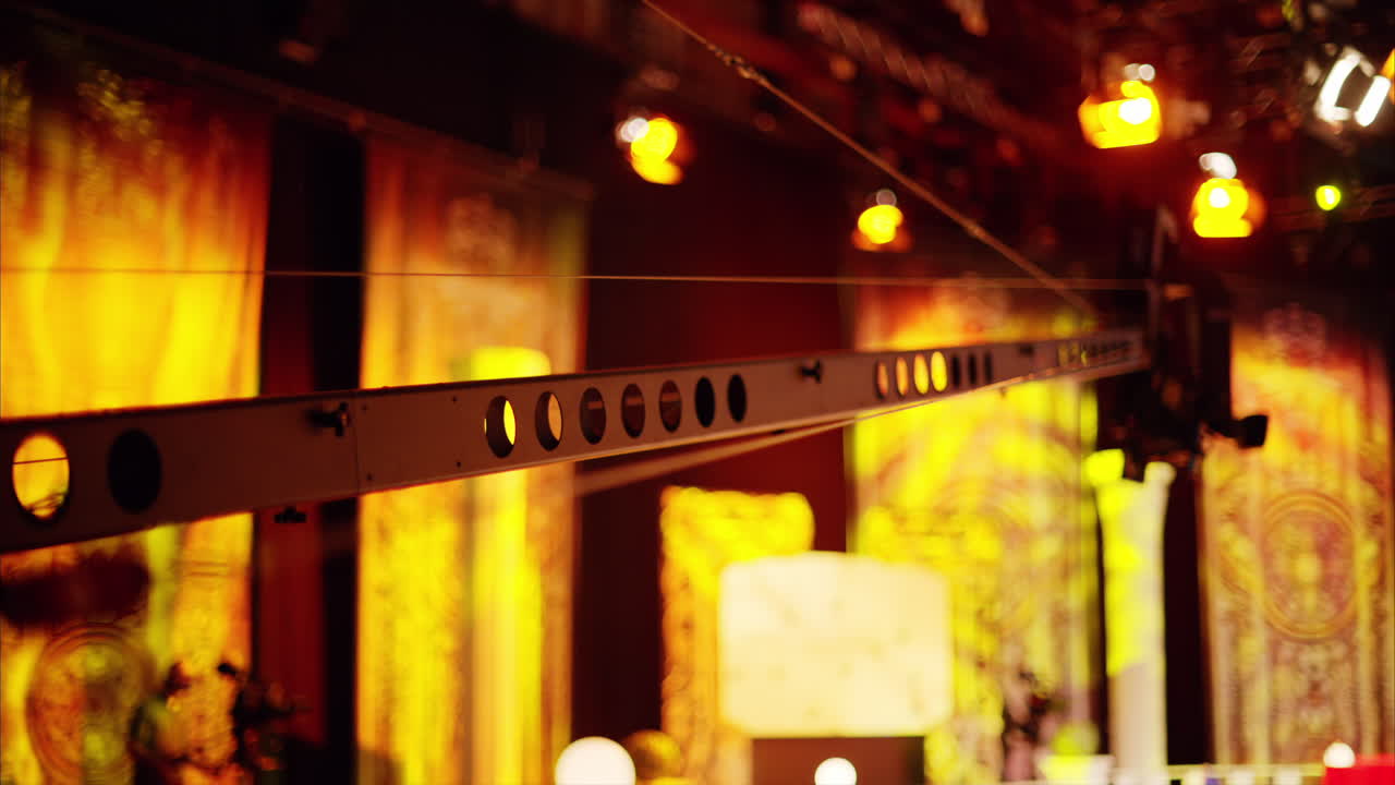 Long professional camera filming with on the backstage of a TV set