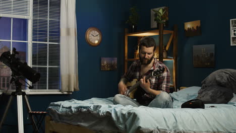 couple enjoying music in bedroom at night