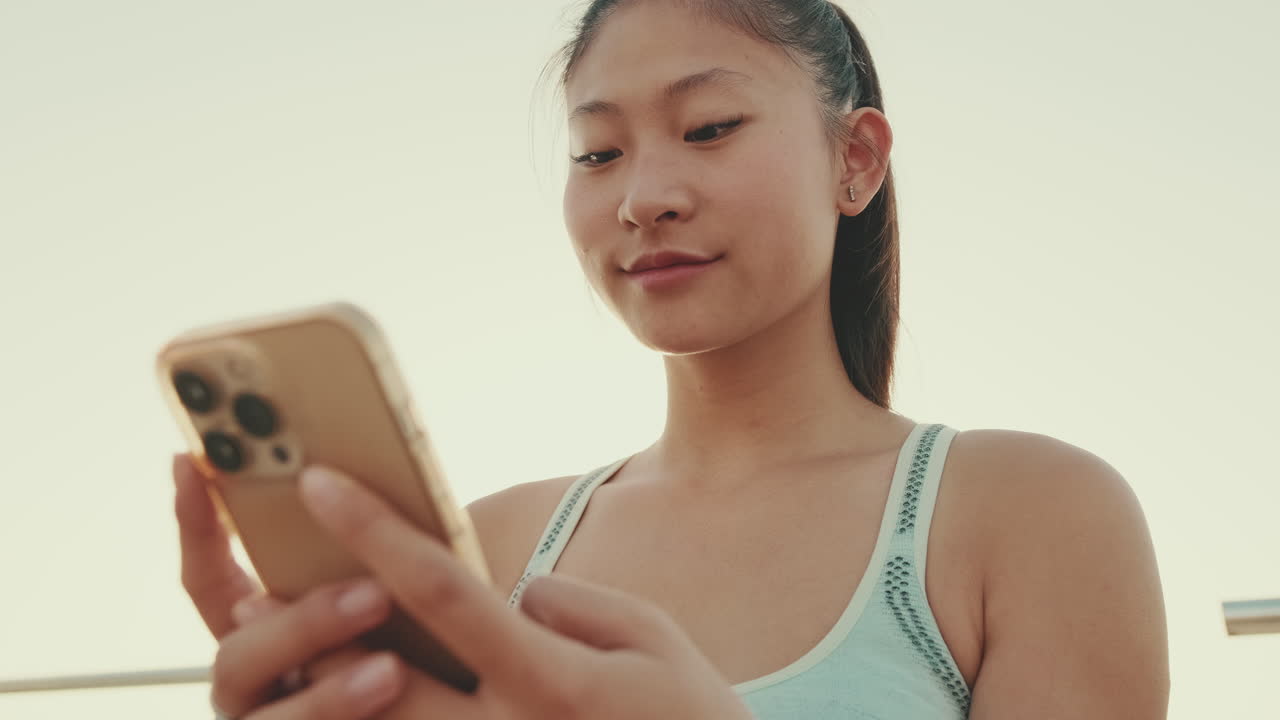 Young Asian woman using mobile phone