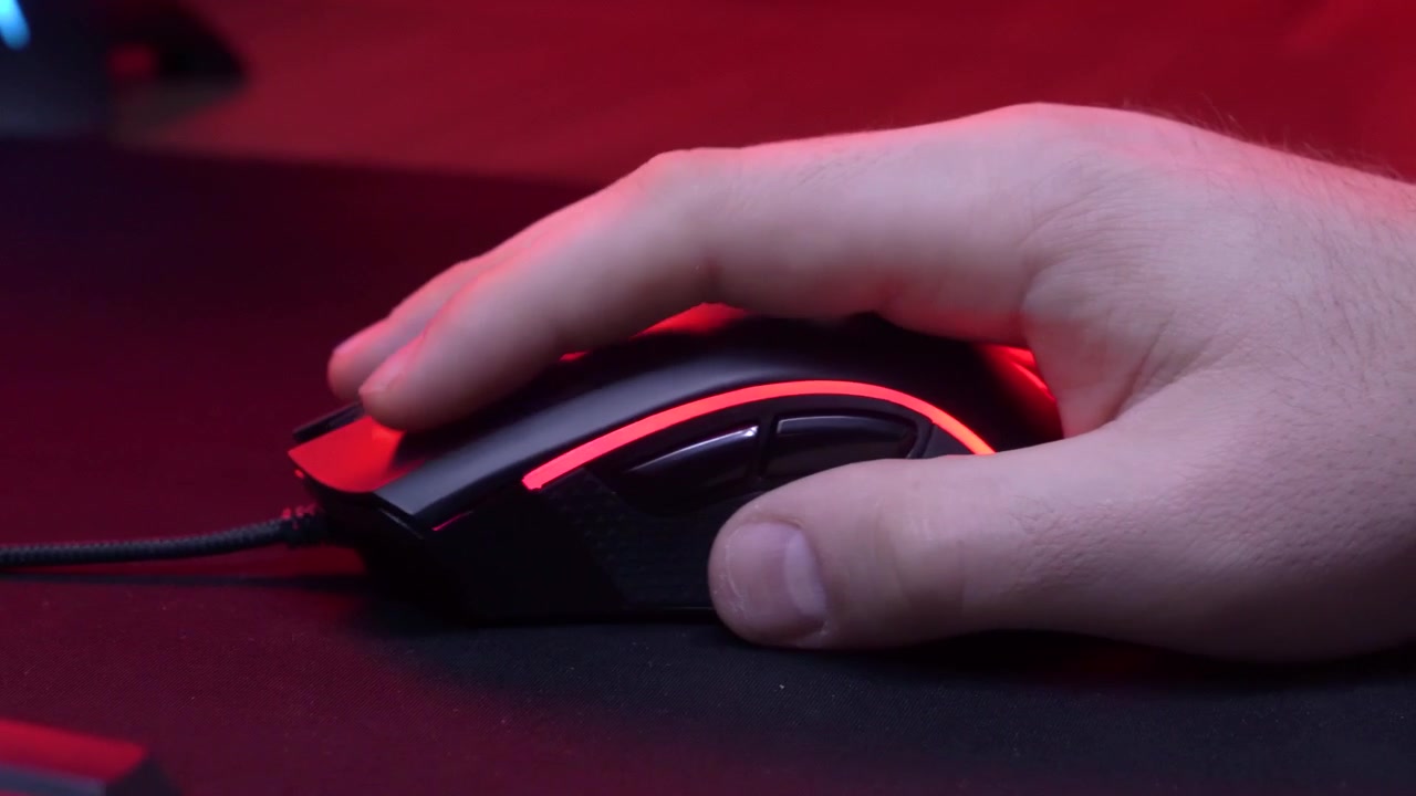 Close-Up of Hand Clicking RGB Gaming Mouse with Changing Lights
