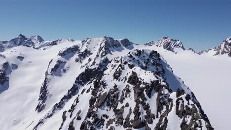 Beautiful-cinematic-aerial-of-snowy-alpine-mountain-glacier-peaks