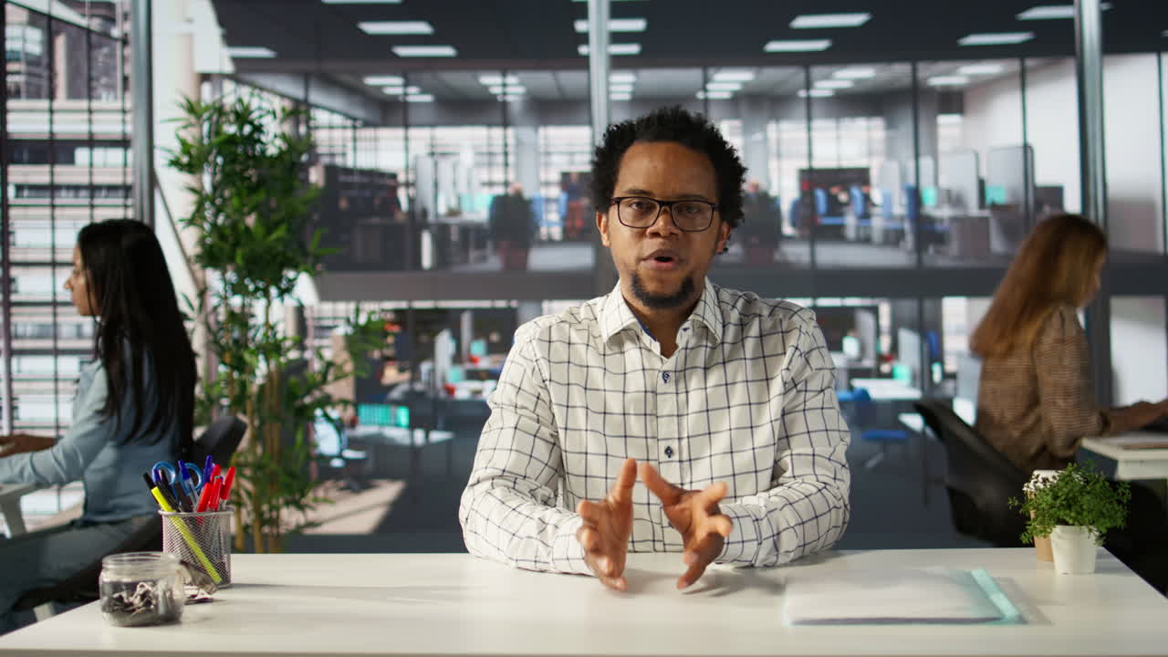 Man in office setting with coworkers