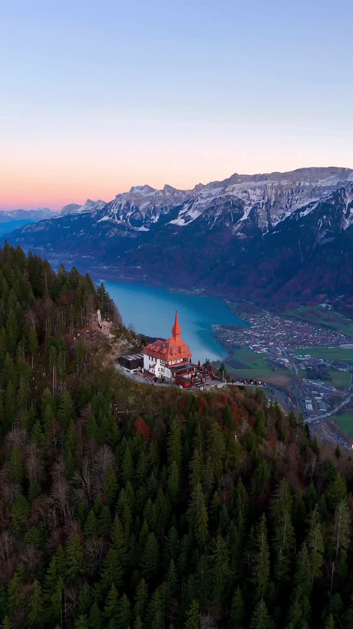 Harder Kulm Panorama Restaurant at sunset in Interlaken captured by drone