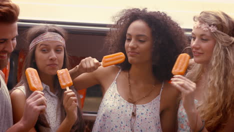 in high quality format hipster friends enjoying ice lollies