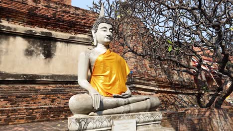 buddha statue with yellow robe in ayutthaya