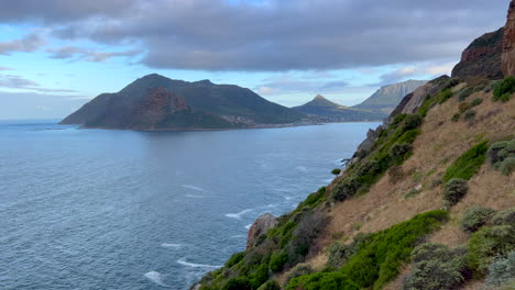 morning chapman peak drive noordhoek hout bay marina scenic table mountain epic coastline view cape of good hope south africa lush spring summer cinematic pan up slowly