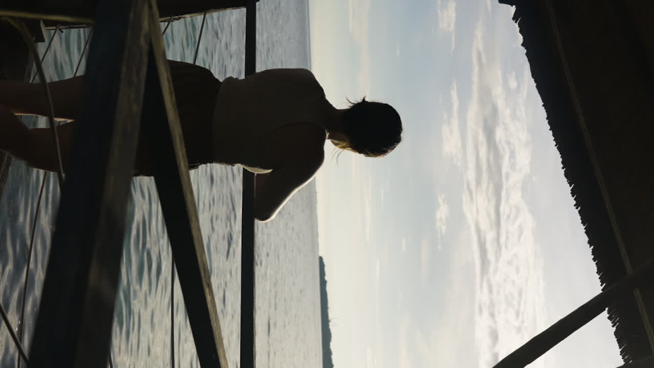 vertical slow-motion shot of a female standing on a villa balcony in Bohol