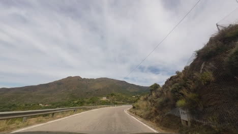 driving uphill in estepona mountains, pov view