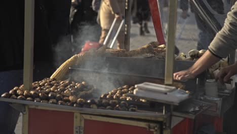 popular street food in istanbul: roasted corn and chestnuts in cart