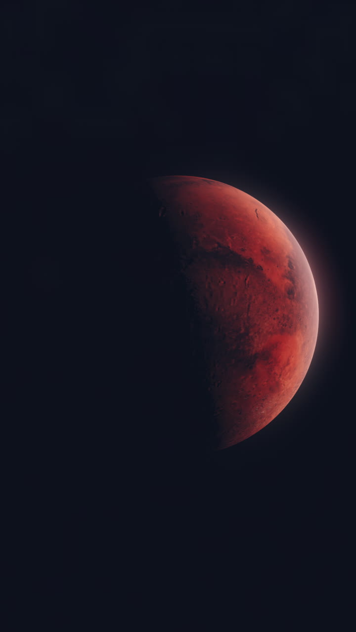 Vertical Video of Mars Rotating with Dark Black Background. Thin Atmosphere Visible with Surface Details including Craters and Mountains. Science Space Footage for Adding to Social Media Videos.
