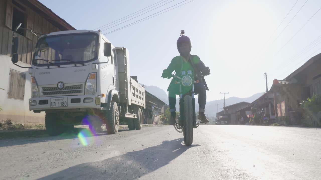 Motorcycle Ride Through a Village Landscape