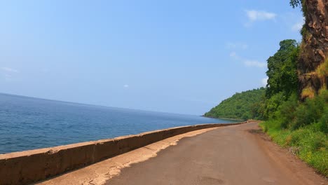 pov shot moving at santa catarina road with the beautiful coast view at são tomé,africa