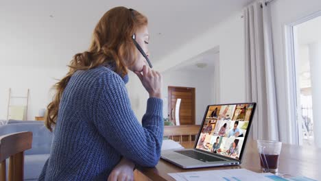 Caucasian-female-teacher-using-laptop-and-phone-headset-on-video-call-with-students