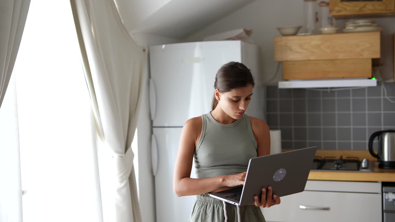 Woman working from home in the kitchen