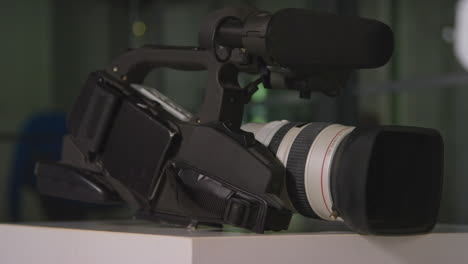 close up of film or video camera and lens for shooting movie or video in studio