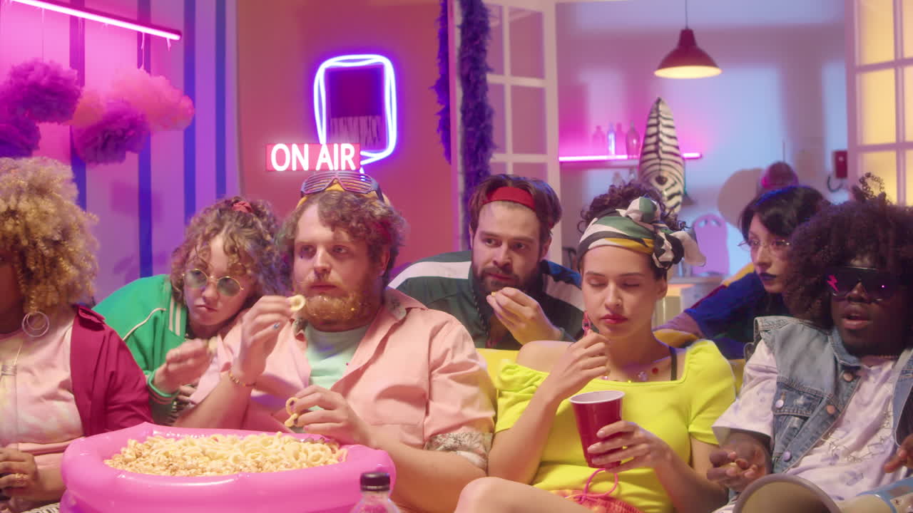 Group of friends watching a movie party