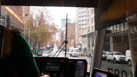 tram navigating busy melbourne city streets