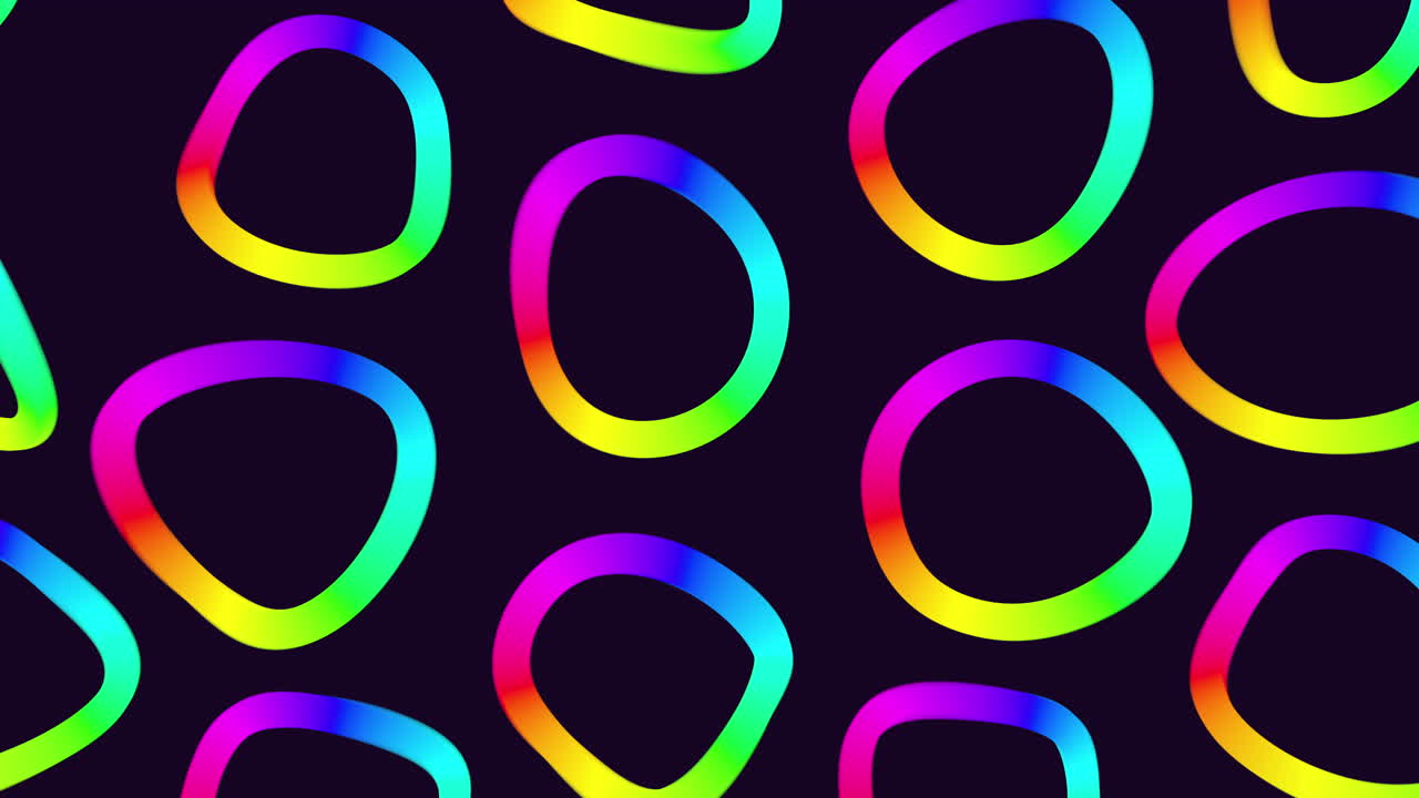 A stunning symmetrical pattern of rainbow colored circles on a black background, with varied sizes overlapping in a spiral arrangement emanating from the largest center circle
