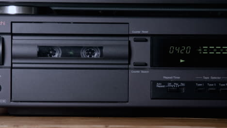 footage of a vintage tape deck or cassette player with a tape counter