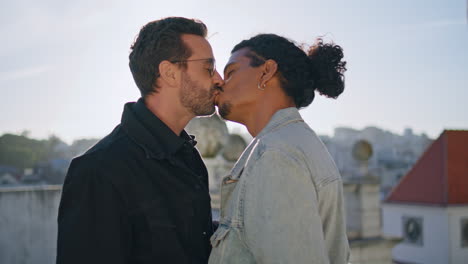 couple kissing on a rooftop