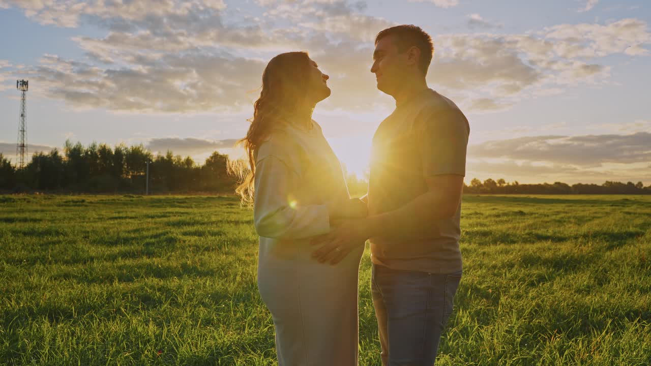 Pregnant Couple at Sunset