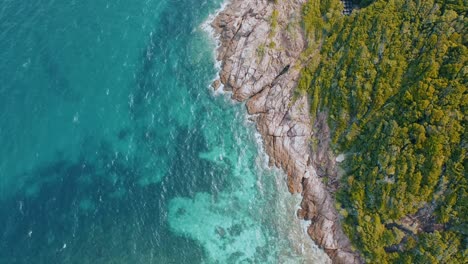 Aerial-Shot-Of-Tropical-Island-with-Crystal-Clear-Sea