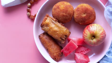 plate of fried snacks and fruit