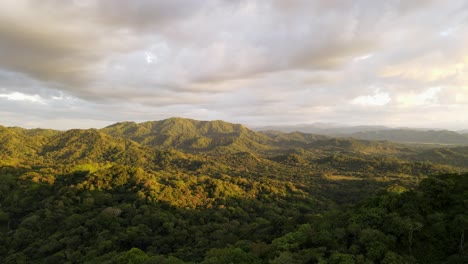 Drone-footage-of-incredibly-vast-tropical-landscape-during-a-vibrant-sunset