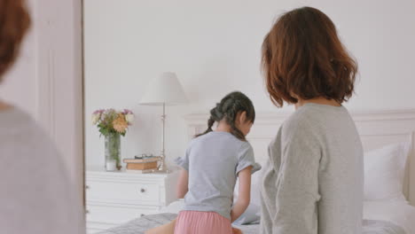 asian-mother-and-daughter-playing-dress-up-game-at-home-little-girl-having-fun-with-mom-enjoying-playful-day-with-child-together-on-weekend-happy-family-4k-footage