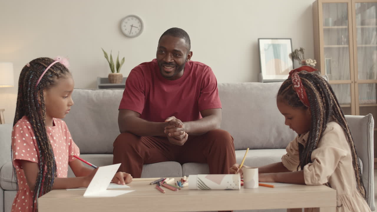 Father Watching Daughters Drawing