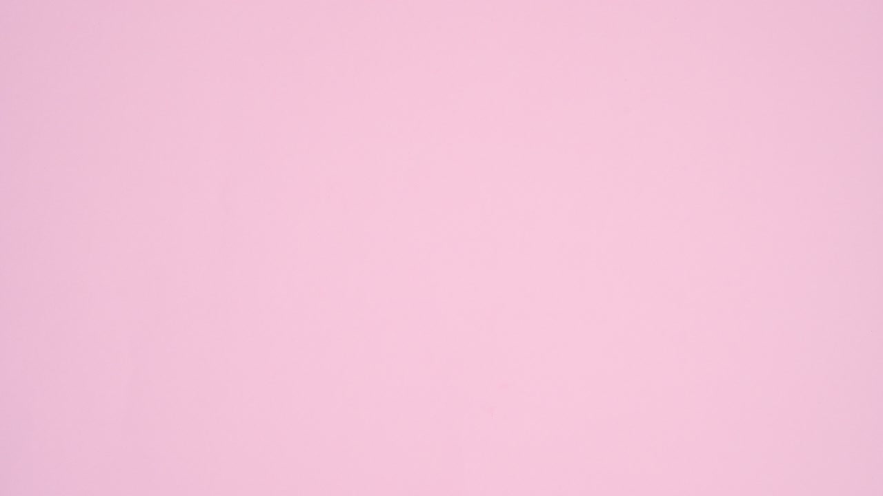 Valentine's day balloons and gift appear around white paper card note. Stop motion flat lay