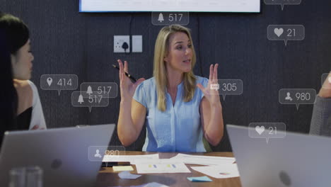in conference room, businesswoman presenting animation on social media engagement metrics