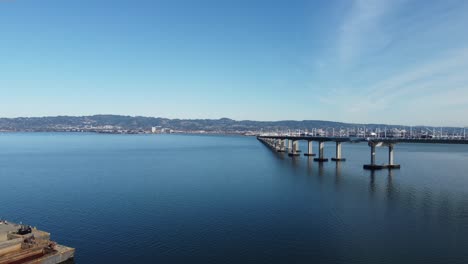 Aerial-Zoom-Out-Footage-of-the-Bay-Bridge-from-Treasure-Island