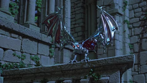 metallic dragon creature on castle wall