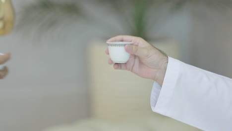 shake the cup of arabic coffee