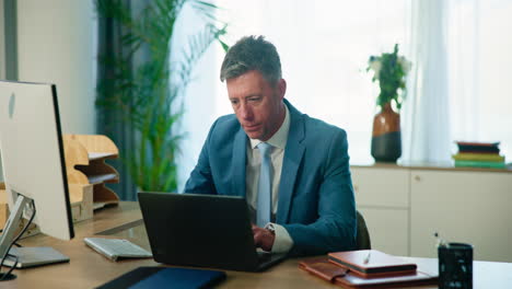 a businessman working at his desk in an office