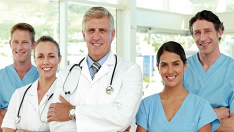 Happy-medical-team-looking-at-camera